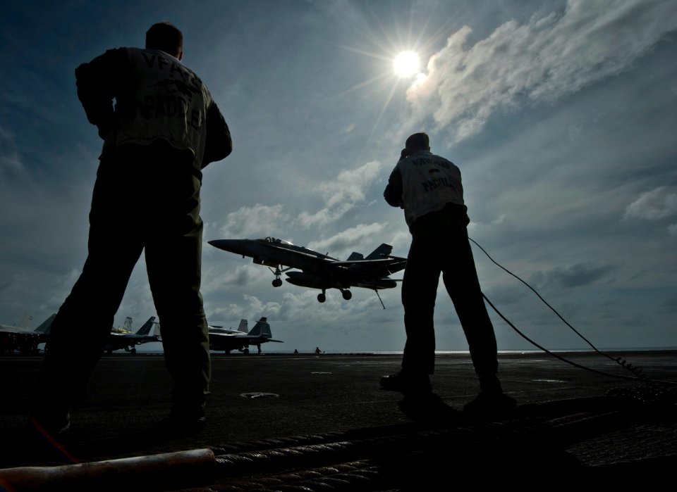 US Navy 120105-N-DR144-056 Landing signal officers guide pilots to safe recoveries aboard the Nimitz-class aircraft carrier USS Carl Vinson (CVN 70