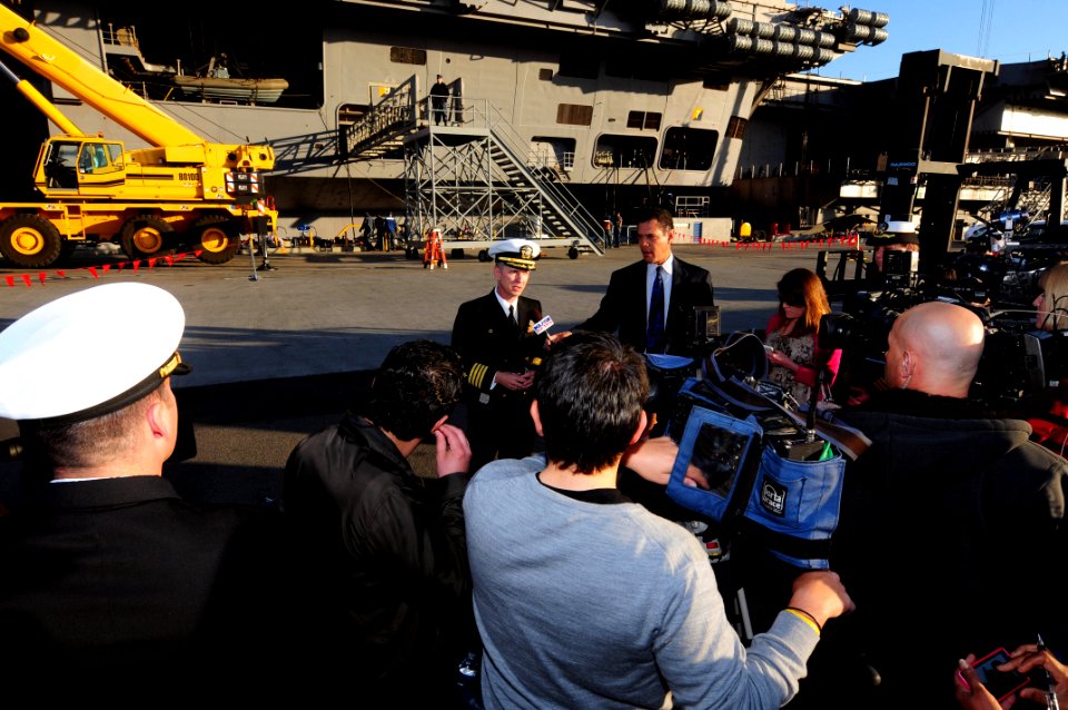 US Navy 120106-N-NB544-028 Capt. Thom Burke, commanding officer of the aircraft carrier USS Ronald Reagan (CVN 76) answers questions during an inte