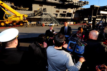 US Navy 120106-N-NB544-028 Capt. Thom Burke, commanding officer of the aircraft carrier USS Ronald Reagan (CVN 76) answers questions during an inte