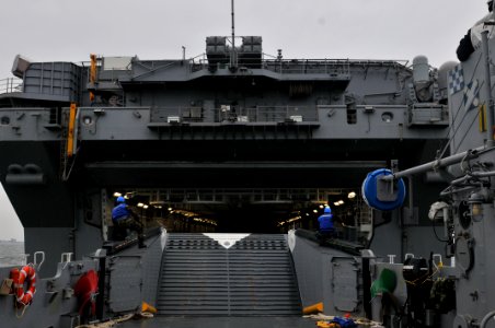 US Navy 120109-N-UM734-370 Landing Craft Utility (LCU) 1654, assigned to Assault Craft Unit 2, enters the well deck of the amphibious assault ship