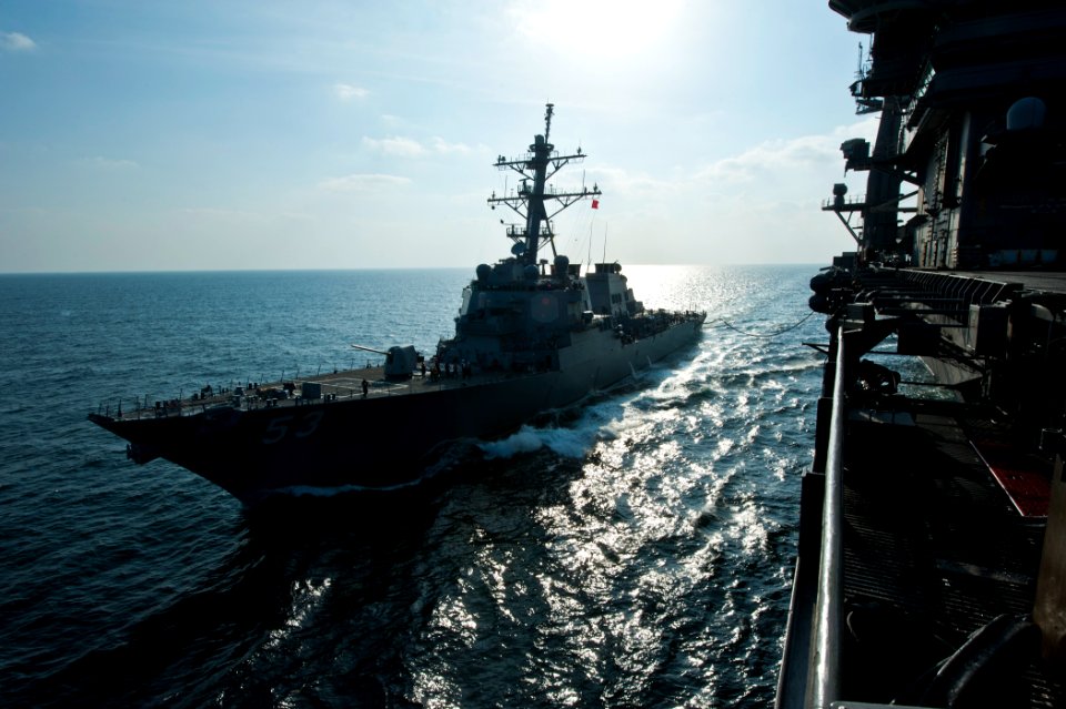 US Navy 120106-N-BT887-198 USS John Paul Jones and USS John C. Stennis cruise together during a fueling at sea