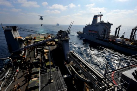 US Navy 120104-N-KS651-151 A helicopter brings supplies to the flight deck