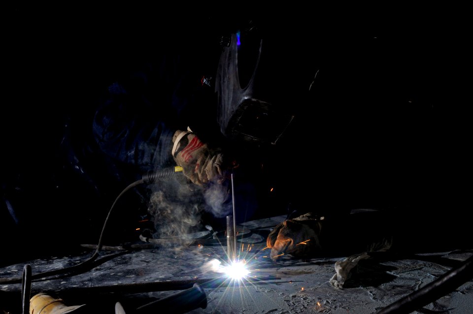 US Navy 120124-N-UT411-034 Hull Maintenance Technician 3rd Class Jesseca Crosby welds new equipment mounts
