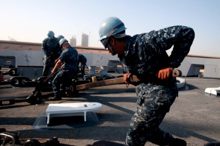 US Navy 120107-N-PB383-321 Sailors secure an anchor
