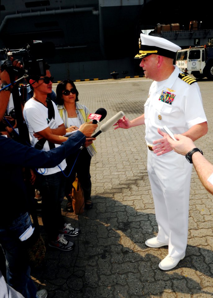 US Navy 120106-N-SK590-049 Capt. John D. Alexander, commanding officer of the Nimitz-class aircraft carrier USS Abraham Lincoln (CVN 72), speaks wi
