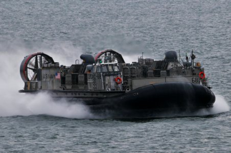 US Navy 120111-N-UM734-163 A landing craft air cushion approaches the well deck of the amphibious assault ship USS Kearsarge (LHD 3) photo