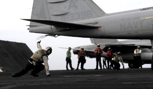 US Navy 120105-N-RG587-371 Troubleshooters assigned to Electronic Attack Squadron (VAQ) 134 signal that an EA-6B Prowler is ready for launch
