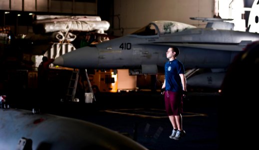 US Navy 120112-N-GC412-367 Intelligence Specialist 3rd Class Christopher Brown jumps rope in the hangar bay aboard the Nimitz-class aircraft carrie