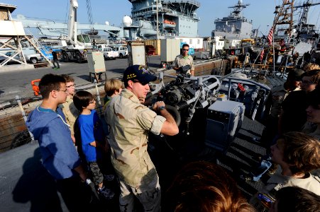 US Navy 120107-N-OX597-080 Lt. Mat Rechkemmer, executive officer of the Cyclone-class coastal patrol ship USS Whirlwind (PC 11), shows a MK-38 25mm