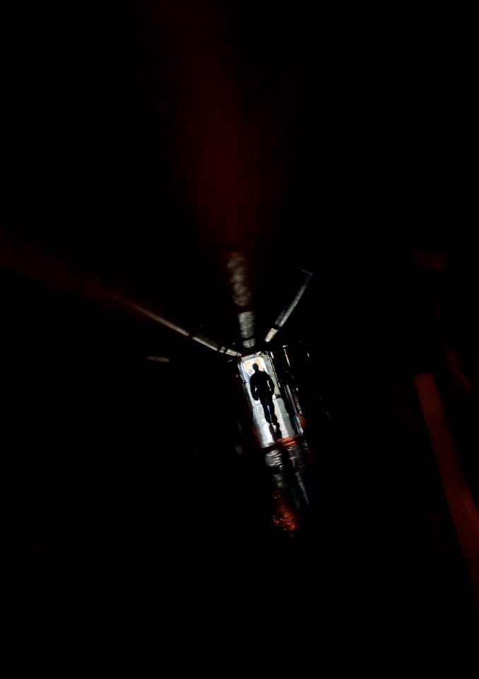US Navy 120110-N-DR144-259 Sailors transit darkened passageways aboard the Nimitz-class aircraft carrier USS Carl Vinson (CVN 70) during a loss of