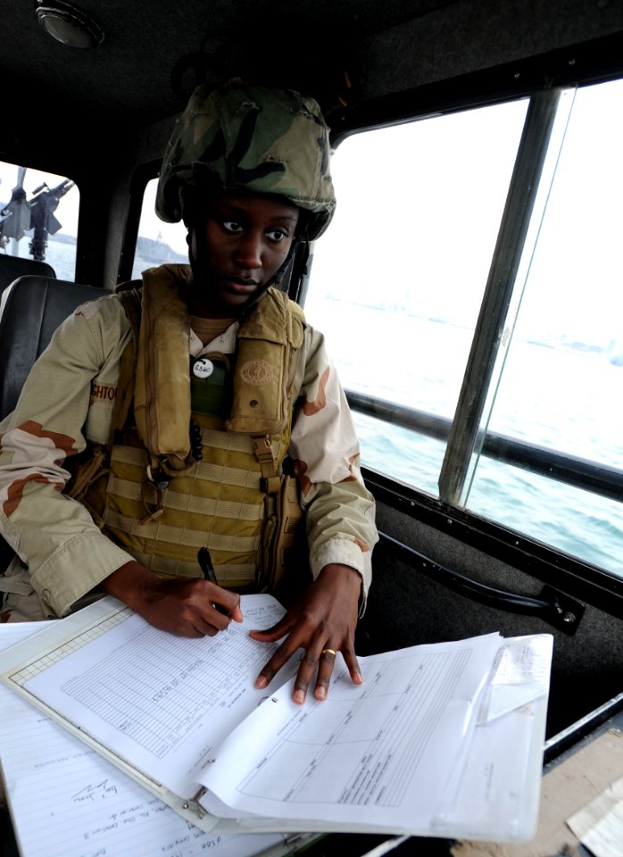 US Navy 120107-N-RP435-657 Boatswain's Mate Seaman Ashley Hightower, assigned to Maritime Expeditionary Squadron (MSRON) 2, observes and records en
