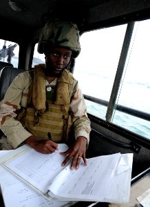 US Navy 120107-N-RP435-657 Boatswain's Mate Seaman Ashley Hightower, assigned to Maritime Expeditionary Squadron (MSRON) 2, observes and records en