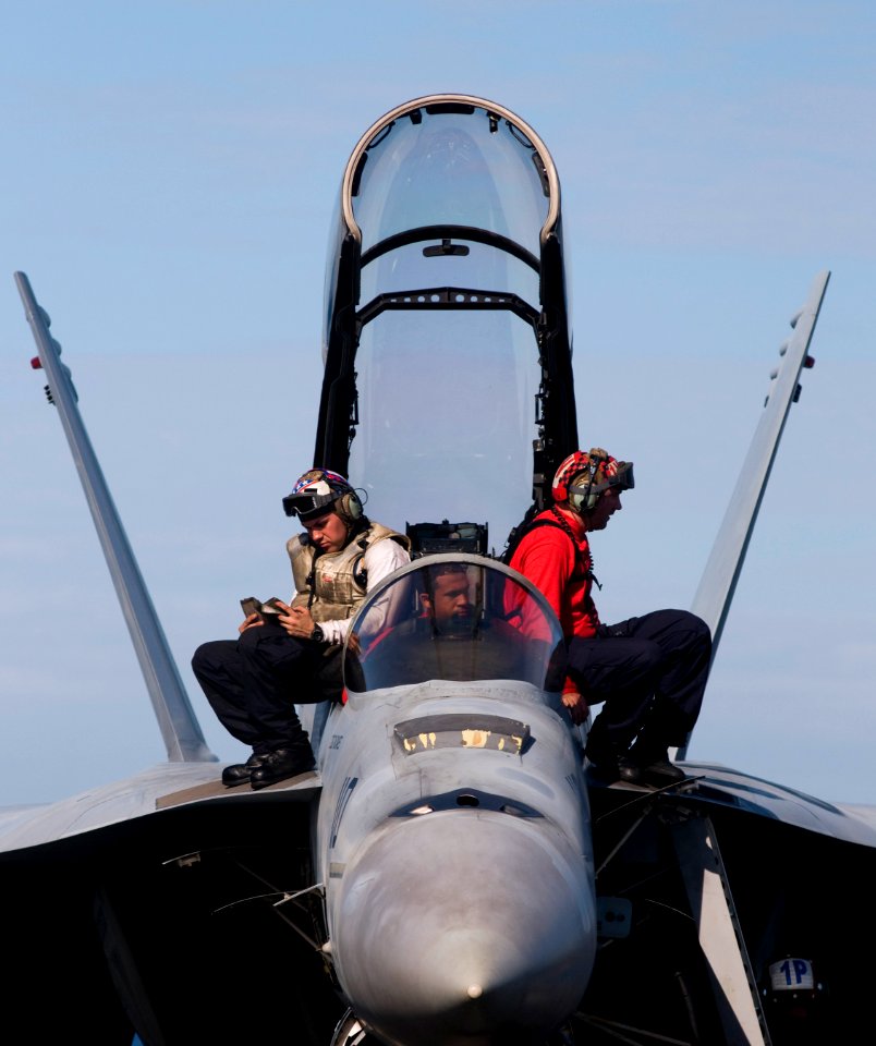 US Navy 120107-N-TZ605-604 Aviation Electrician's Technician 3rd Class Adrian Vigil, Aviation Ordnanceman 2nd Class Torian Taylor and Aviation Ordn