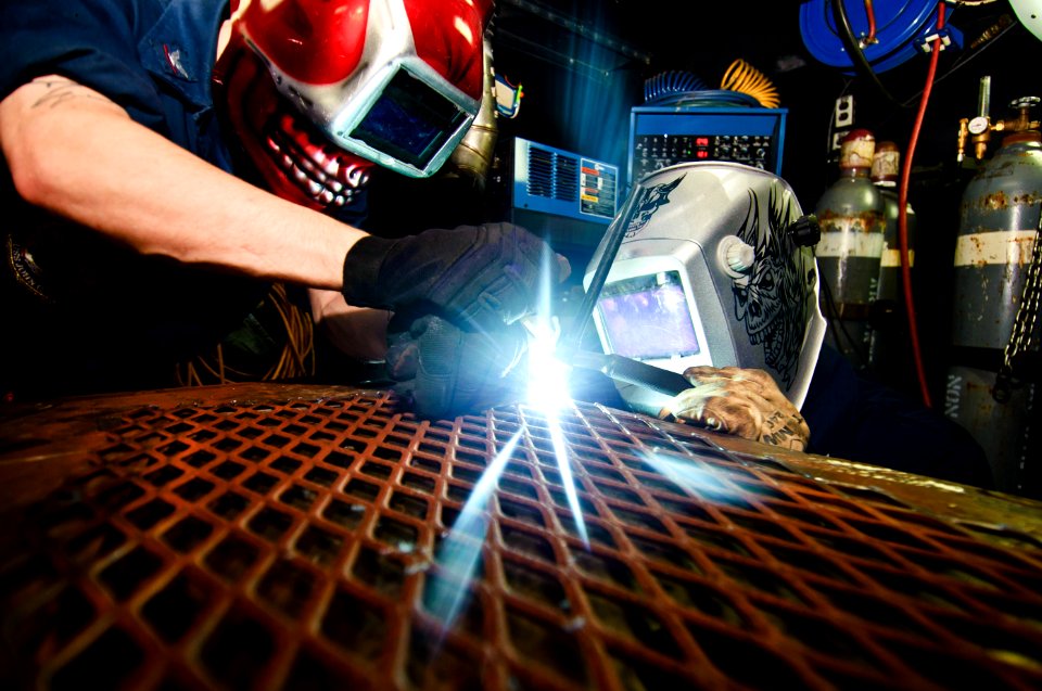 US Navy 120108-N-GC412-001 Hull Maintenance Technician 3rd Class Dustin Lenhardt and Hull Maintenance Technician 3rd Class Cody Eitniear weld in th