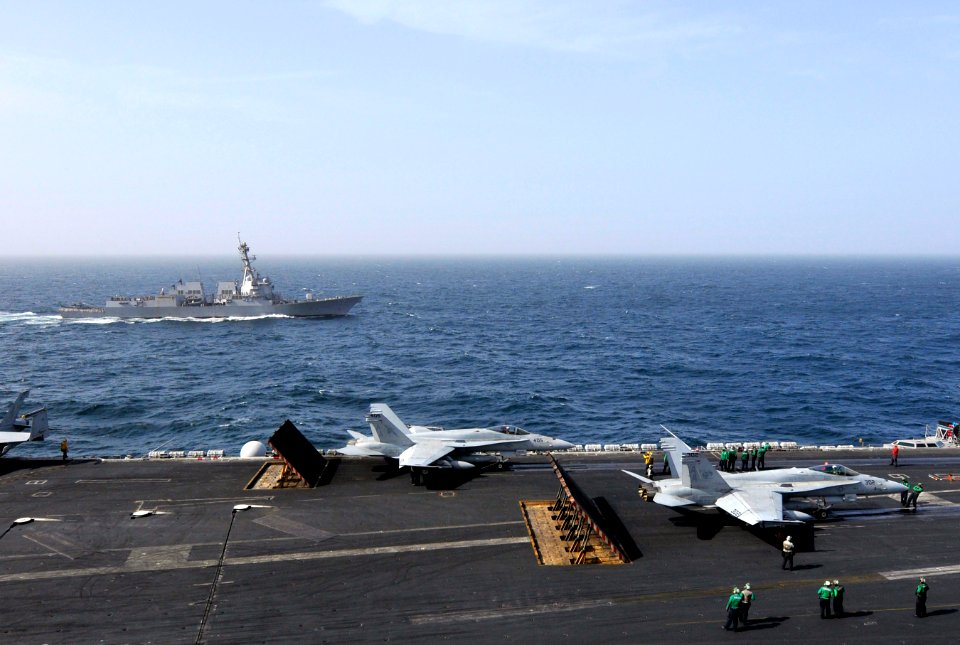 US Navy 120213-N-ZI635-438 The Arleigh Burke-class guided-missile destroyer USS Momsen (DDG 92) pulls alongside the Nimitz-class aircraft carrier U