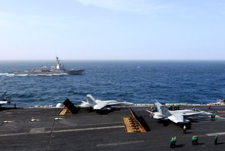 US Navy 120213-N-ZI635-438 The Arleigh Burke-class guided-missile destroyer USS Momsen (DDG 92) pulls alongside the Nimitz-class aircraft carrier U photo