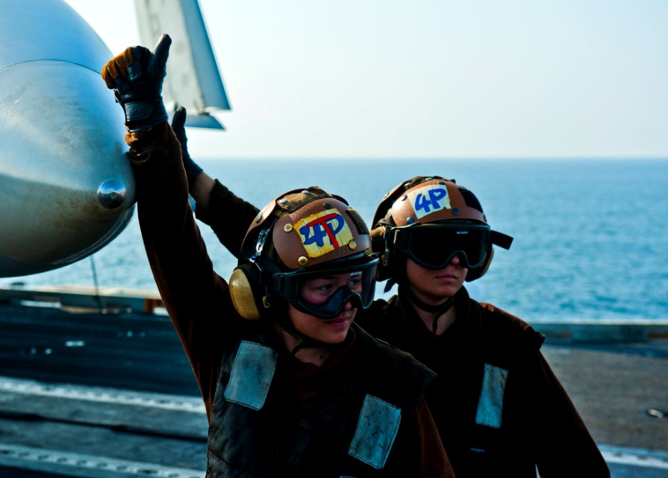 US Navy 120109-N-BT887-051 Aviation Structural Mechanic Airman Amanda Mason and Aviation Electronics Technician Airman Kelsey Parker give the appro
