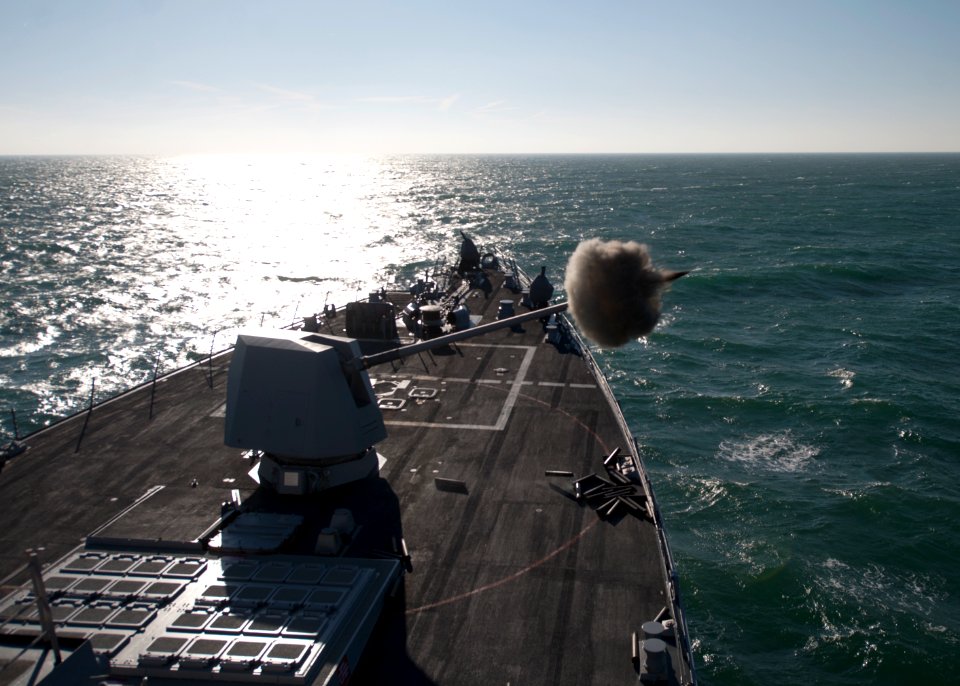 US Navy 120112-N-NL401-141 The guided-missile destroyer USS James E. Williams (DDG 95) fires the Mk-45 5-inch-62 caliber lightweight gun during a l