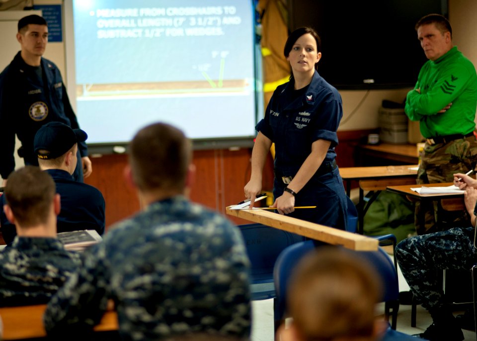 US Navy 120116-N-BT887-030 Damage Controlman 3rd Class Meagan Lofton, from Atlanta, Texas, teaches a shoring class aboard the Nimitz-class aircraf
