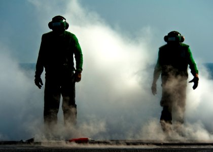 US Navy 120112-N-BT887-077 Sailors reset a steam-powered catapult for flight operations aboard the Nimitz-class aircraft carrier USS John C. Stenni