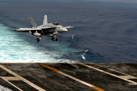 US Navy 120111-N-ZZ999-264 An F-A-18C Hornet, assigned to Strike Fighter Squadron (VFA) 25, approaches the flight deck aboard the Nimitz-class airc