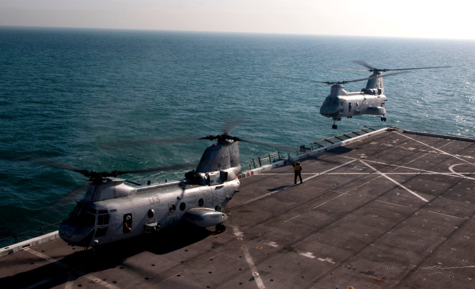 US Navy 120114-N-PB383-271 A helicopter takes off the flight deck