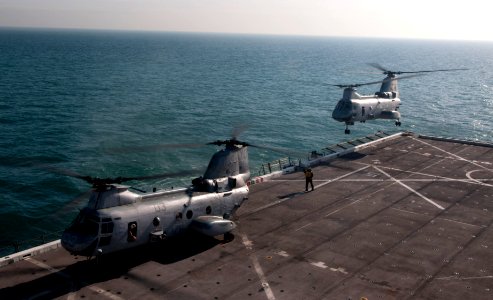 US Navy 120114-N-PB383-271 A helicopter takes off the flight deck