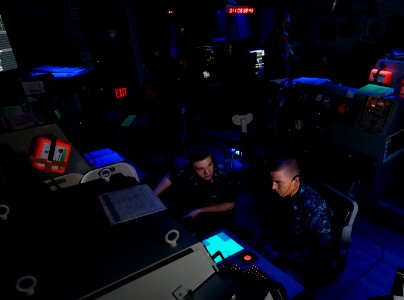 US Navy 120111-N-TZ605-126 Sailors assigned to the operations department aboard the Nimitz-class aircraft carrier USS Carl Vinson (CVN 70), monitor