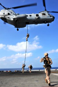 US Navy 120112-N-KD852-206 Marines assigned to the 11th Marine Expeditionary Unit (11th MEU) fast rope from a CH-46E Sea Knight helicopter onto th