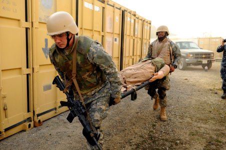 US Navy 120112-N-GO179-011 Sailors transport a patient during the tactical combat casualty care training Program photo