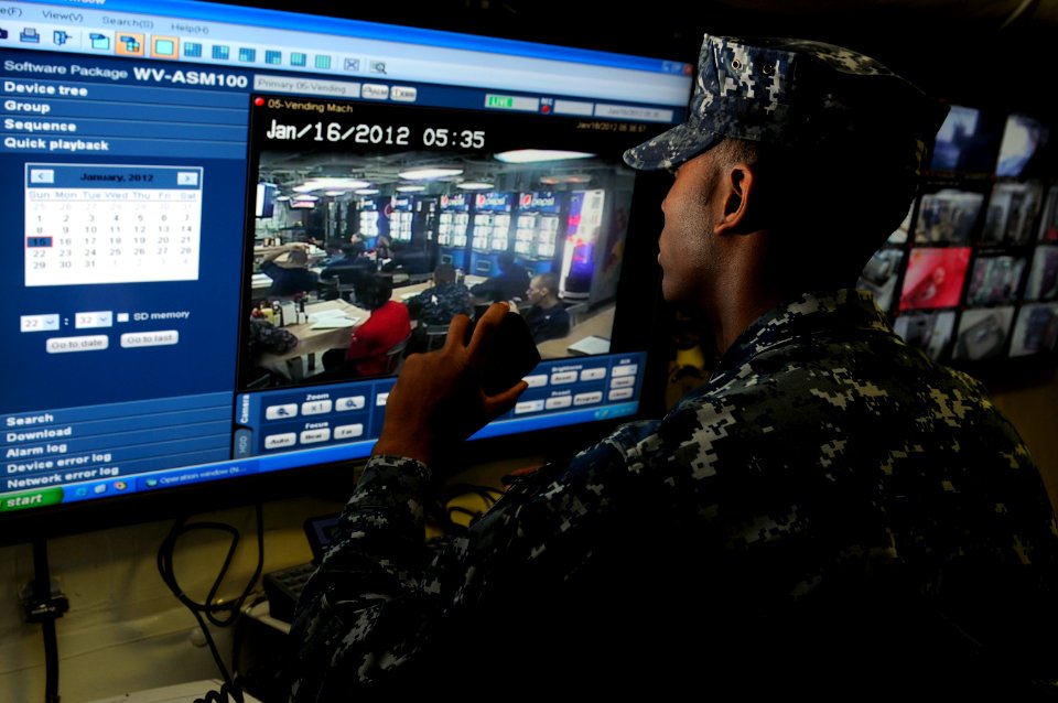 US Navy 120116-N-RG587-009 A Sailor reviews security cameras