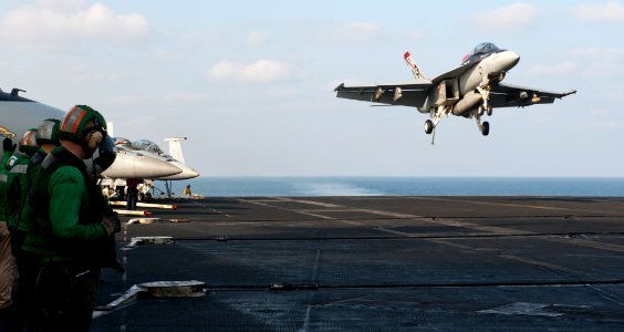 US Navy 120112-N-OY799-298 An F-A-18F Super Hornet from the Black Aces of Strike Fighter Squadron (VFA) 41 lands on the flight deck of the Nimitz-c