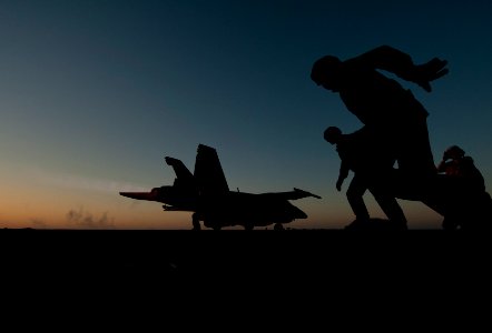 US Navy 120118-N-DR144-620 Flight deck personnel launch an F-A-18F Super Hornet assigned to Strike Fighter Squadron (VFA) 22 from the flight deck