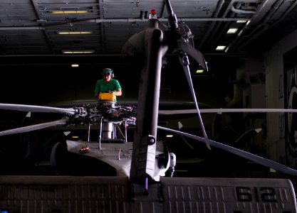 US Navy 120112-N-TZ605-429 Aviation Electrician's Mate 2nd Class Patrick Sablan, assigned to Helicopter Anti-Submarine Squadron (HS) 15, performs m
