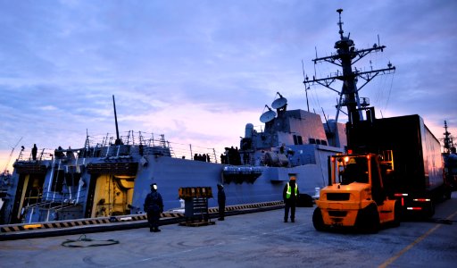 US Navy 120111-N-NL401-011 Sailors aboard the guided-missile destroyer USS James E. Williams (DDG 95) load equipment and parts onto the ship prior