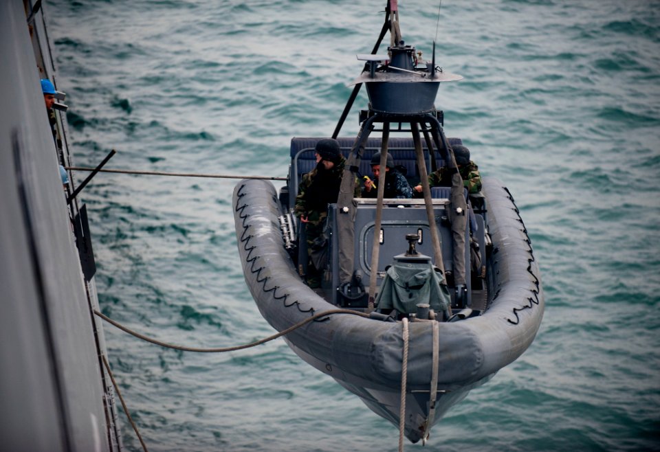 US Navy 120113-N-PB383-561 Sailors assigned to the amphibious transport dock ship USS New Orleans (LPD 18) lower a rigid-hull inflatable boat into
