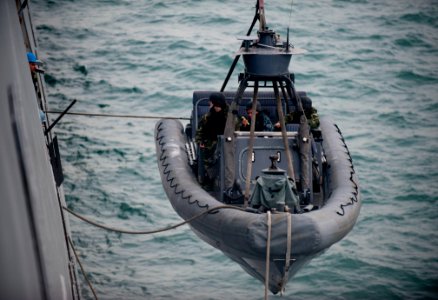 US Navy 120113-N-PB383-561 Sailors assigned to the amphibious transport dock ship USS New Orleans (LPD 18) lower a rigid-hull inflatable boat into