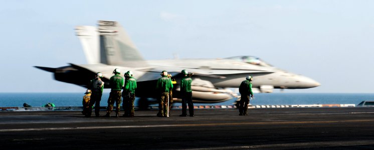 US Navy 120112-N-OY799-292 An F-A-18C Hornet from the Warhawks of Strike Fighter Squadron (VFA) 97 launches from the flight deck of the Nimitz-clas