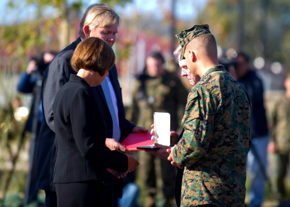 US Navy 120117-N-AC887-047 The Secretary of the Navy (SECNAV), the honorable Ray Mabus, presents the family of Lance Cpl. Donald Hogan Navy Cross d