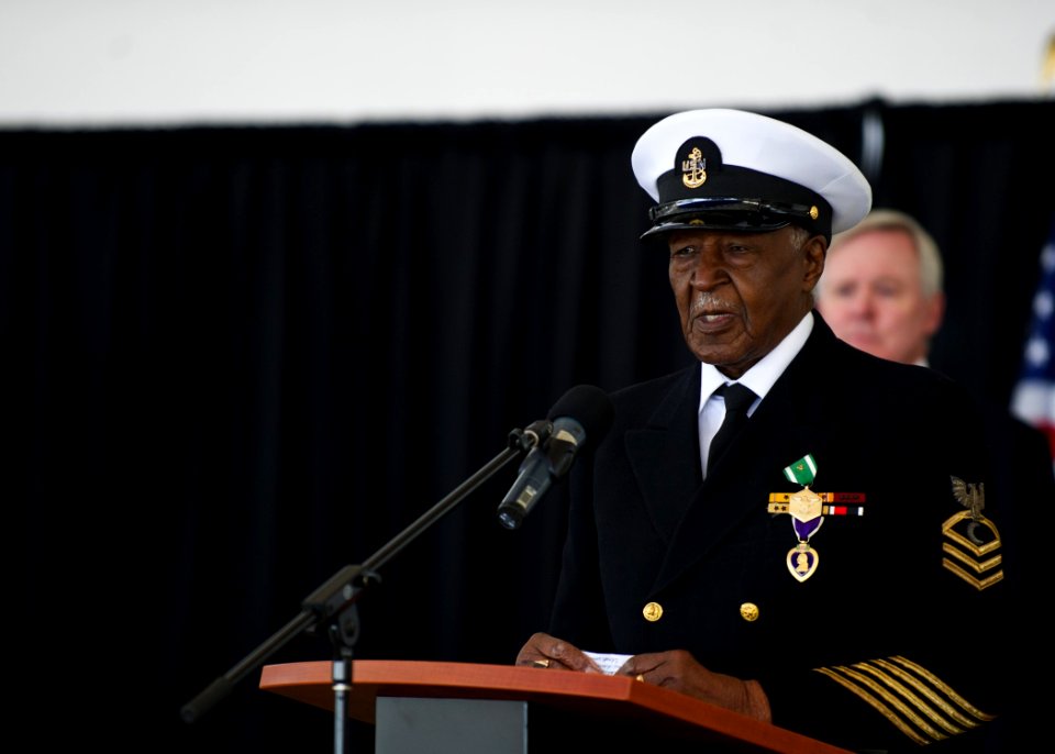 US Navy 120117-N-AC887-784 Retired Chief Petty Officer Carl E. Clark delivers remarks after Secretary of the Navy (SECNAV) the honorable Ray Mabus