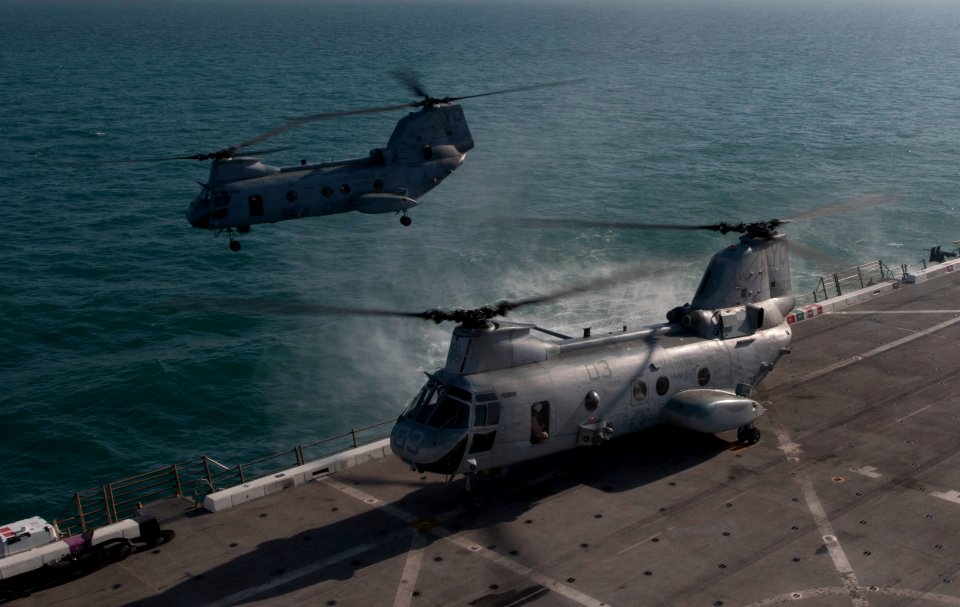US Navy 120114-N-PB383-291 A helicopter takes off the flight deck
