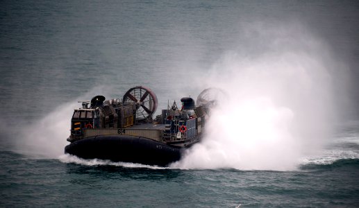 US Navy 120113-N-PB383-439 A landing craft air cushion, assigned to Assault Craft Unit (ACU) 5, approaches the well deck of the amphibious transpor