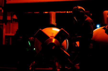 US Navy 120118-N-MD252-490 Sailors assigned to Strike Fighter Squadron (VFA) 22 perform corrosion prevention maintenance on an aerial refueling sys
