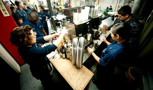 US Navy 120112-N-OY799-020 Sailors serve coffee on the mess decks aboard the Nimitz-class aircraft carrier USS John C. Stennis (CVN 74)