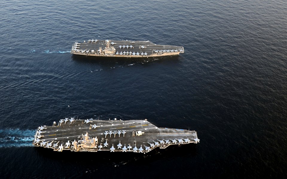 US Navy 120119-N-QH883-124 The Nimitz-class aircraft carriers USS Abraham Lincoln (CVN 72) and USS John C. Stennis (CVN 74) join for a turnover of