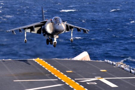 US Navy 120112-N-UM734-268 An AV-8B Harrier performs a vertical landing on the flight deck of the amphibious assault ship USS Kearsarge (LHD 3)