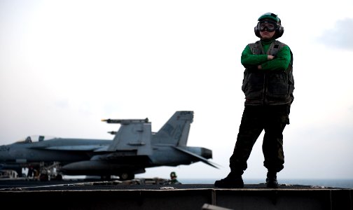 US Navy 120115-N-OY799-274 Aviation Boatswain's Mate (Equipment) Airman Kelsie Pukallus observes flight maneuvers during night flight operations on