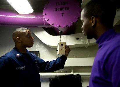 US Navy 120117-N-DR144-049 A Sailor uses a heat stress monitor to measure temperature