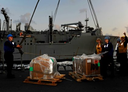 US Navy 120116-N-VH839-010 Sailors aboard the Arleigh Burke-class guided-missile destroyer USS Dewey (DDG 105) detach the spanner wire from two inc photo