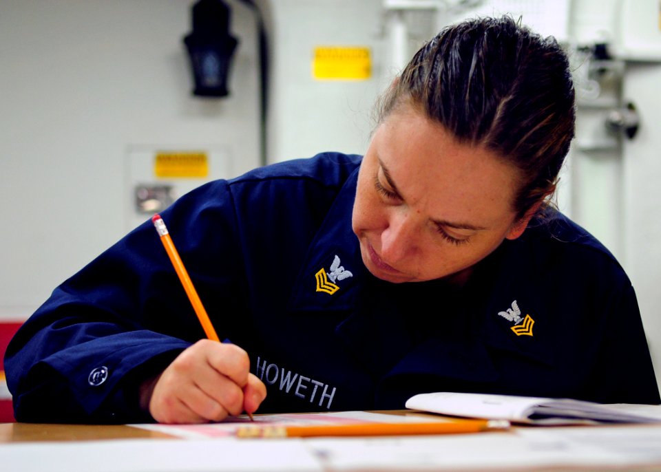 US Navy 120119-N-ZF681-253 Yeoman 1st Class Anna Howeth takes the navy-wide chief petty officer advancement exam aboard the guided-missile destroye